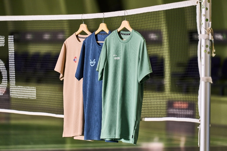 Three RSL t-shirts hanging on a badminton net with visible brand logos.
